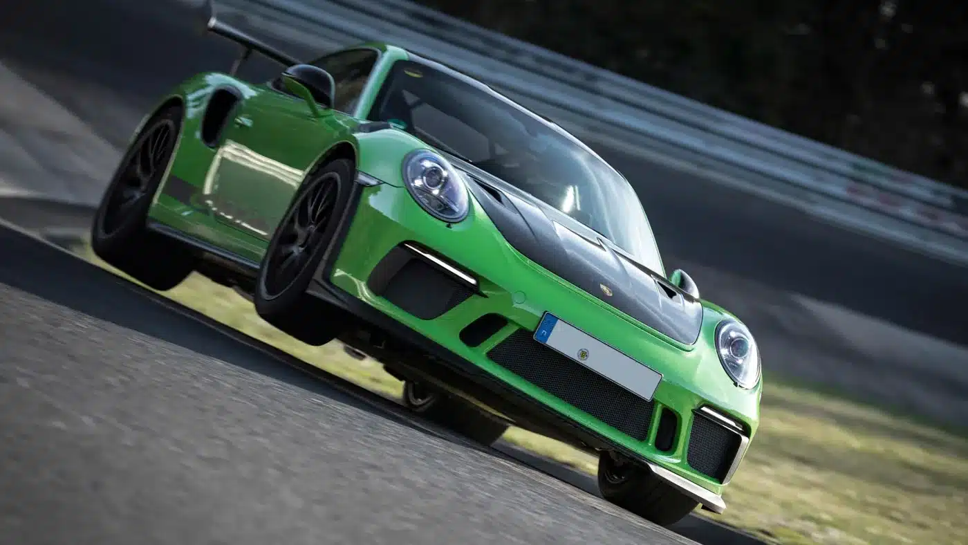 Porsche 997 GT3 RS in RS Green with Black accents on the Nurburgring Nordschleife, front three-quarter view